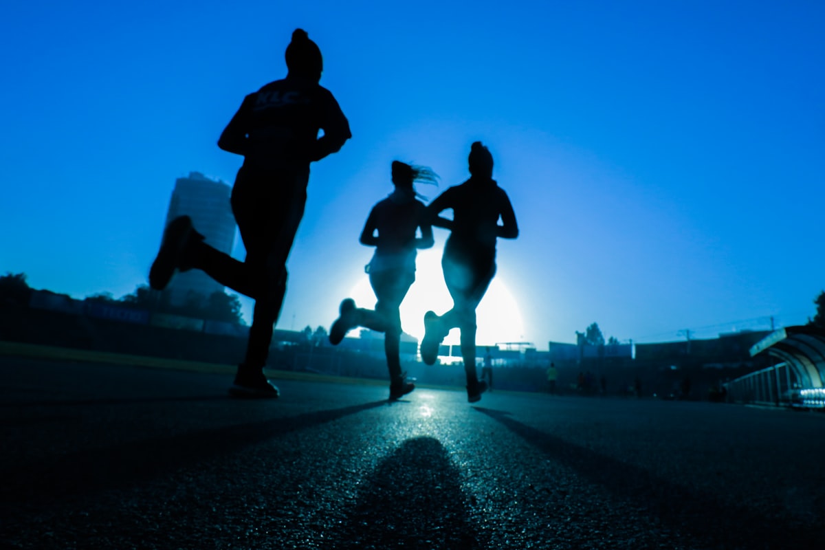 Runner on trail at sunrise